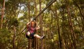 Man soaring through the air at Treetops Adventure Central Coast